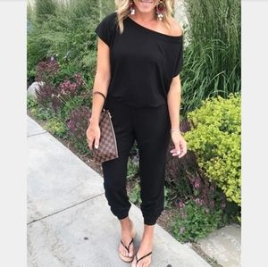 Full black off-the-shoulder jumpsuit with pockets